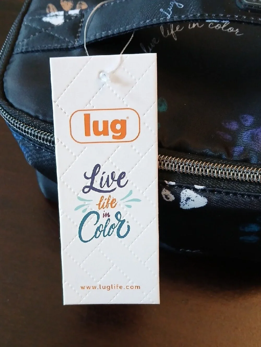 lug Black Cosmetic Case with Multicolor Paw Prints